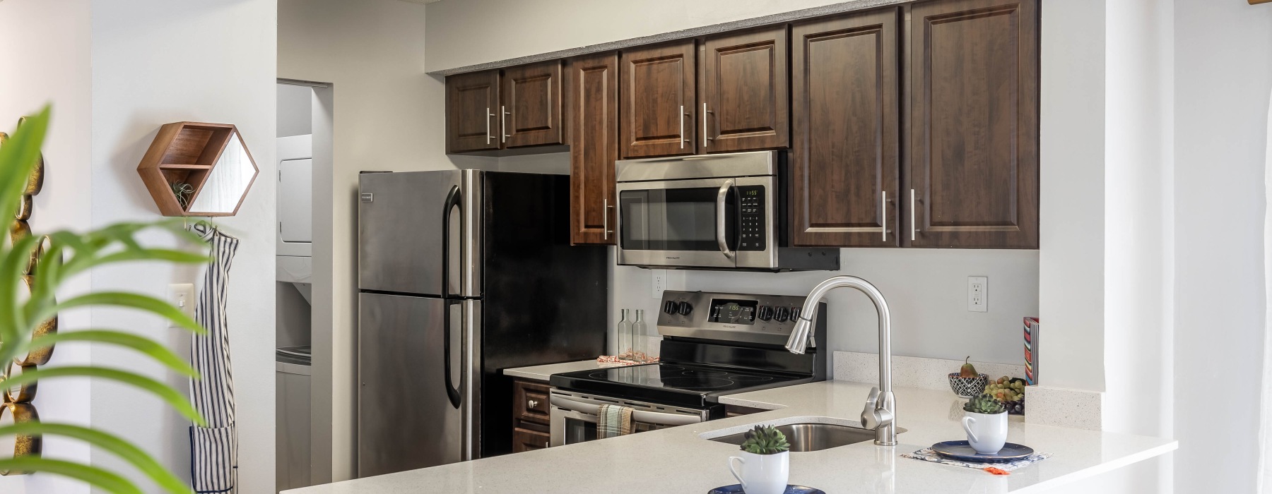 View of kitchen with bar stools